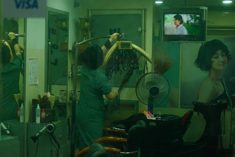 a woman in a hair salon getting her hair done